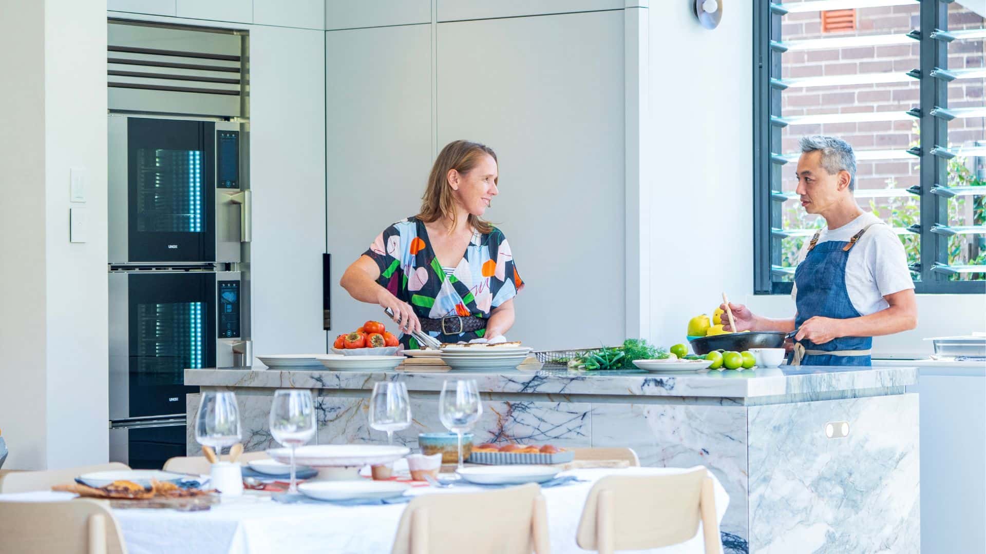 Christopher Thé and his wife preparing dinner with Model 1