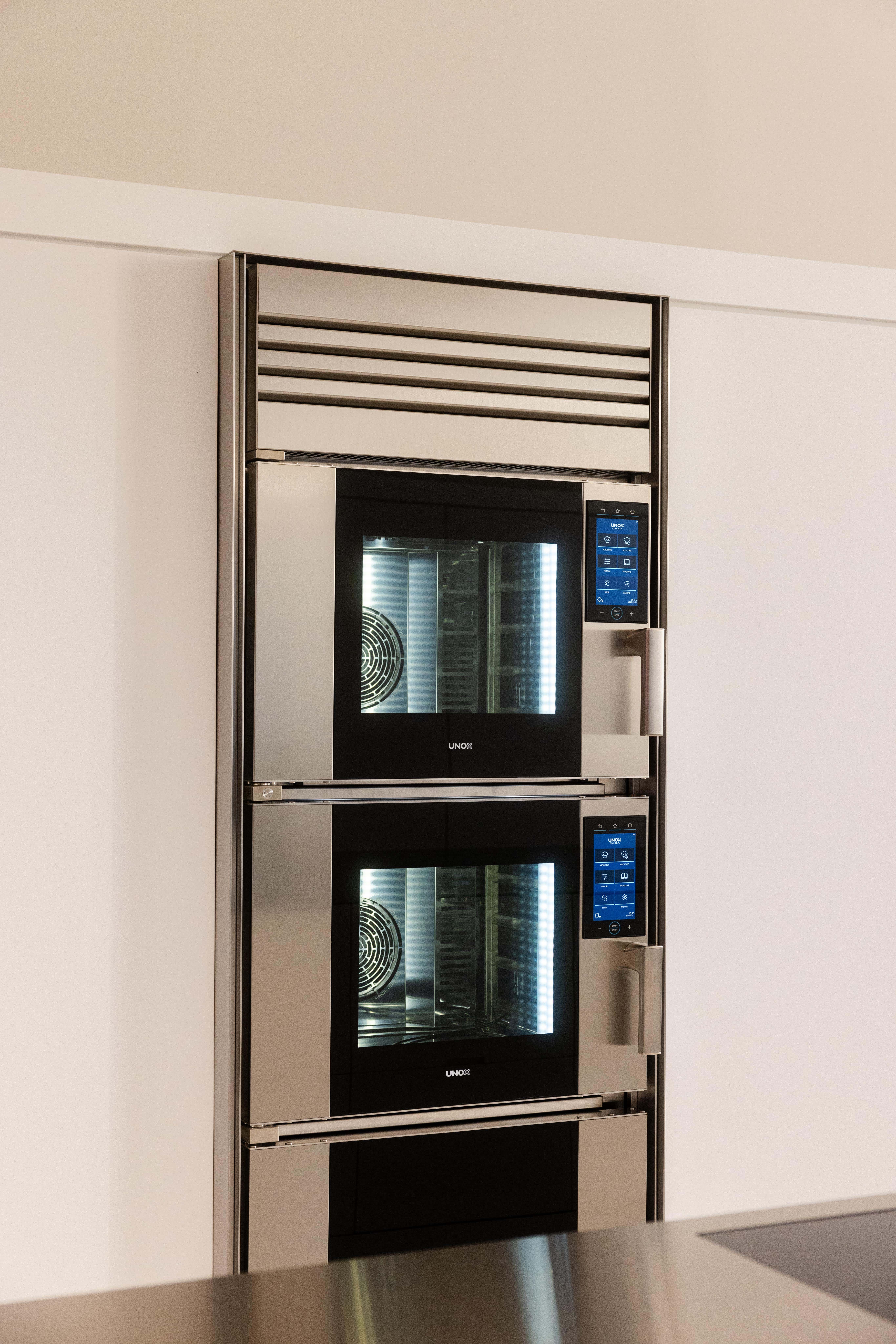 Unox Casa Model 1 wall oven installed in a total white luxury kitchen