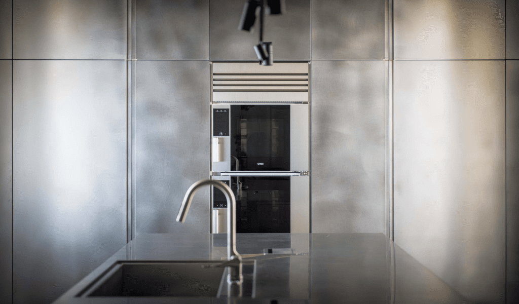 Model 1S in a designer modern kitchen completely made of stainless steel
