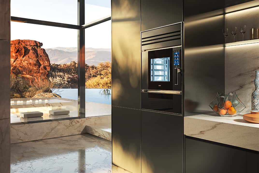 Unox Casa Model 1S Black Edition wall oven in a dark kitchen of a desert villa